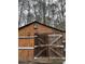 Image of an old wooden barn with double doors at 5435 Hearn Rd, Ellenwood, GA 30294