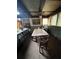 Dining room with a vintage ceiling fan and a large wooden table at 5435 Hearn Rd, Ellenwood, GA 30294