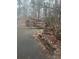 A weathered outbuilding featuring wooden doors and overgrown foliage at 5435 Hearn Rd, Ellenwood, GA 30294