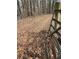 A metal gate sits at the entrance to the wooded land for sale at 5435 Hearn Rd, Ellenwood, GA 30294