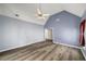 Bedroom with vaulted ceilings, wood-look floors, and neutral blue walls at 3069 Commons Crossing, Snellville, GA 30078