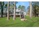 Charming raised home featuring a spacious deck overlooking a lush, green lawn at 462 Lakeshore Dr, Stockbridge, GA 30281