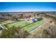 Aerial view of newly constructed residential area with green spaces, paved streets, and modern homes at 5760 Tillman Way, Powder Springs, GA 30127