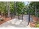 Gated entrance with a secure fence leading to a private driveway surrounded by trees at 5760 Tillman Way, Powder Springs, GA 30127