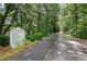 Scenic walking trail featuring an etiquette sign surrounded by greenery at 5760 Tillman Way, Powder Springs, GA 30127