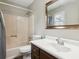 Functional bathroom featuring a shower, bathtub, toilet and single sink with a mirror at 3113 Melissa Ct, Douglasville, GA 30135