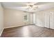Bright bedroom with hardwood floors, a ceiling fan, and a window with closet space at 3113 Melissa Ct, Douglasville, GA 30135