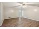 Spacious room featuring new wood flooring, neutral walls and abundant lighting at 3113 Melissa Ct, Douglasville, GA 30135