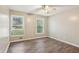 Bedroom featuring stylish flooring, neutral paint, and two windows for natural light at 3113 Melissa Ct, Douglasville, GA 30135