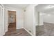 Neutral hallway featuring modern gray walls and dark wood flooring at 3113 Melissa Ct, Douglasville, GA 30135