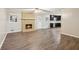 Bright living area with a brick fireplace, open to the kitchen at 3113 Melissa Ct, Douglasville, GA 30135