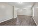 Spacious room with new wood flooring, neutral walls and abundant lighting at 3113 Melissa Ct, Douglasville, GA 30135