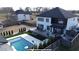 Aerial view of a backyard oasis, pool, patio, and outdoor lounge for entertaining and relaxation at 557 Loth Wages Rd, Dacula, GA 30019