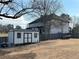A spacious backyard features a modern shed, offering ample storage and complements the home's exterior at 557 Loth Wages Rd, Dacula, GA 30019