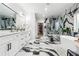 A luxurious bathroom features dual sinks, a freestanding tub, and a glass-enclosed shower at 557 Loth Wages Rd, Dacula, GA 30019