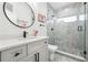 Modern bathroom featuring a glass-enclosed shower, black fixtures, and a stylish vanity at 557 Loth Wages Rd, Dacula, GA 30019