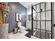 Modern bathroom featuring a stylish glass-enclosed shower, sleek vanity, and contemporary fixtures at 557 Loth Wages Rd, Dacula, GA 30019