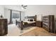 Bedroom with wood floors, natural light, modern decor, and accent furniture at 557 Loth Wages Rd, Dacula, GA 30019