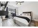 Bedroom with wood floors, natural light, modern decor, and desk at 557 Loth Wages Rd, Dacula, GA 30019