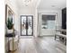 Inviting entryway with hardwood floors, modern décor, and a stylish console table at 557 Loth Wages Rd, Dacula, GA 30019