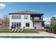 Stunning two-story home with outdoor lounge area, pool views, and manicured landscaping at 557 Loth Wages Rd, Dacula, GA 30019