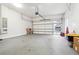 Spacious two car garage with epoxy floor, equipped with modern amenities and ample space for vehicles and storage at 557 Loth Wages Rd, Dacula, GA 30019