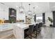 Kitchen with marble island and countertops, modern appliances, and island seating at 557 Loth Wages Rd, Dacula, GA 30019