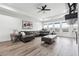 Bright living room with large windows, hardwood floors, and comfortable seating at 557 Loth Wages Rd, Dacula, GA 30019