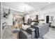 Living area has hardwood floors, fireplace, modern decor, and a view of the kitchen and dining area at 557 Loth Wages Rd, Dacula, GA 30019