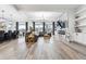 Spacious living room with hardwood floors, large windows, a marble fireplace, and open concept design at 557 Loth Wages Rd, Dacula, GA 30019