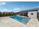 Beautiful pool with seamless steps, complemented by a spacious patio and well-manicured landscaping at 557 Loth Wages Rd, Dacula, GA 30019