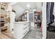 Walk-in closet featuring custom shelving, storage, and plenty of natural light at 557 Loth Wages Rd, Dacula, GA 30019