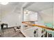 A carpeted attic area with railing and finished walls at 11765 Fairway Overlook, Fayetteville, GA 30215