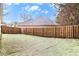 Large, fenced backyard with plenty of green space, offering privacy and room for recreation at 11765 Fairway Overlook, Fayetteville, GA 30215