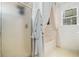 Bathroom featuring a tub, a shower, and a robe hung next to the shower unit at 11765 Fairway Overlook, Fayetteville, GA 30215