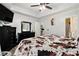Comfortable bedroom with a cow-print bedspread and natural light at 11765 Fairway Overlook, Fayetteville, GA 30215