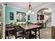 Inviting dining area adjacent to the kitchen, featuring wood look floors and stylish decor at 11765 Fairway Overlook, Fayetteville, GA 30215