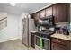 Well-equipped kitchen features stainless steel appliances and ample countertop space at 11765 Fairway Overlook, Fayetteville, GA 30215