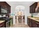 Traditional kitchen featuring wood cabinets, granite countertops, and stainless steel appliances at 11765 Fairway Overlook, Fayetteville, GA 30215