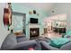 Inviting living room featuring a fireplace, comfortable seating and dining area at 11765 Fairway Overlook, Fayetteville, GA 30215