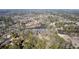 Aerial shot of land showcasing lush trees with lake views at 3000 Cathedral Place, Decatur, GA 30034