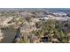 Aerial view of wooded lot with access to lake and a church in Decatur, Georgia at 3000 Cathedral Place, Decatur, GA 30034