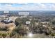 An aerial view of the home nestled among trees with lake views, near Flat Shoals Pkwy and a Publix at 3000 Cathedral Pl, Decatur, GA 30034