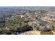 Overhead view of a property near a tranquil lake, surrounded by trees and lush landscapes in a serene neighborhood setting at 3000 Cathedral Pl, Decatur, GA 30034