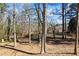 Picturesque backyard with mature trees that provide shade and privacy at 3000 Cathedral Pl, Decatur, GA 30034