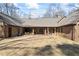 Backyard patio with plenty of room for outdoor dining, seating, and entertaining with privacy at 3000 Cathedral Pl, Decatur, GA 30034
