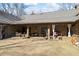 Covered backyard patio featuring plenty of room for entertaining, dining, and other outdoor activities at 3000 Cathedral Pl, Decatur, GA 30034