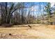Expansive backyard featuring a fountain and direct access to the tranquil waters of the lake at 3000 Cathedral Pl, Decatur, GA 30034