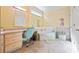 Well-lit bathroom with decorative walls, cabinets, vanity and a tub at 3000 Cathedral Pl, Decatur, GA 30034