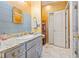 Bathroom with gray cabinets, granite countertops, and modern fixtures at 3000 Cathedral Pl, Decatur, GA 30034